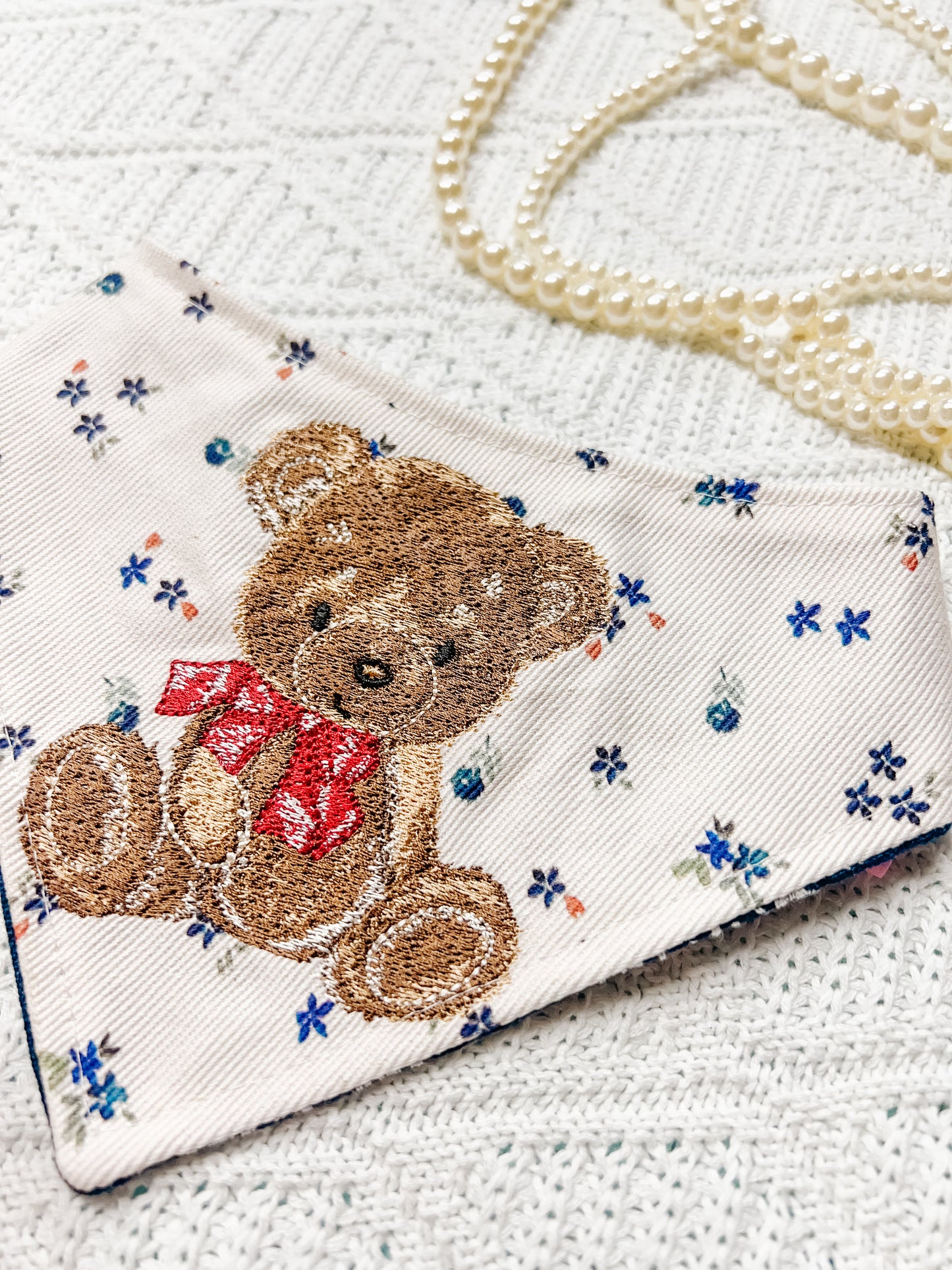 Teddy Bow on Flowers